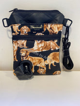 Load image into Gallery viewer, Golden Retriever on black fabric, black leather feel vinyl. This bag is perfect if you do not take too much out with you whilst walking. Comes with a handy poo bag dispenser and  treat pocket.  The main part of the bag has a pocket for your phone, enough space for your keys and cash.